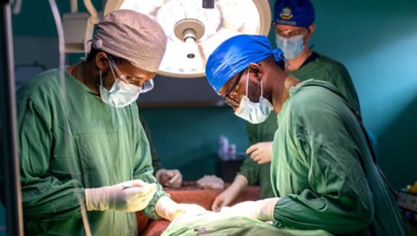 physicians operating on patient